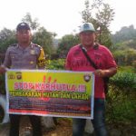 Menggunakan Sepanduk, Brigpol Hemy Sampaikan Himbauan Kamtibmas